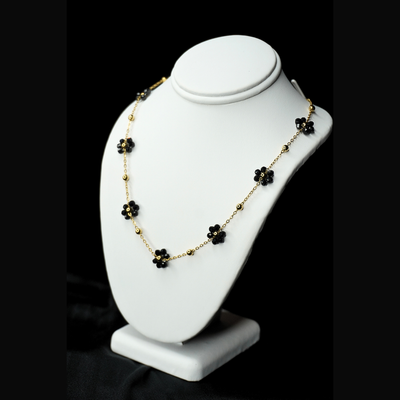 GOLD NECKLACE WITH BLACK GEMSTONE FLOWERS